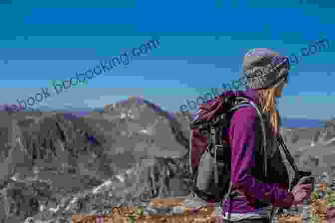 A Woman Hiking Through A Rugged Mountain Landscape, Capturing The Spirit Of Adventure Featured In The Book The Best Women S Travel Writing Volume 12: True Stories From Around The World