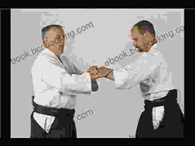 Aikidoka Executing A Wrist Lock Aikido Basics: Everything You Need To Get Started In Aikido From Basic Footwork And Throws To Training (Tuttle Martial Arts Basics)