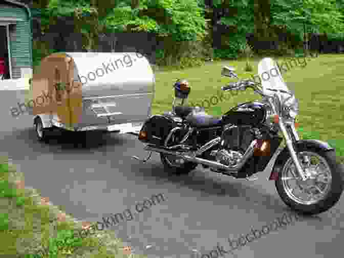 Motorcycle Campers Interacting With Each Other Around A Campfire. The Fundamentals Of Motorcycle Camping