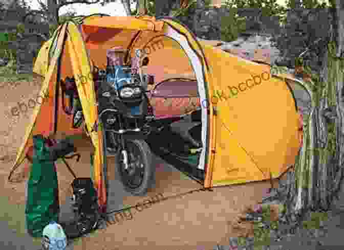 Motorcycle Camping Equipment, Including A Tent, Sleeping Bag, And Cooking Gear. The Fundamentals Of Motorcycle Camping